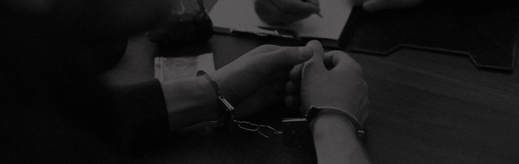 Person in handcuffs during interrogation