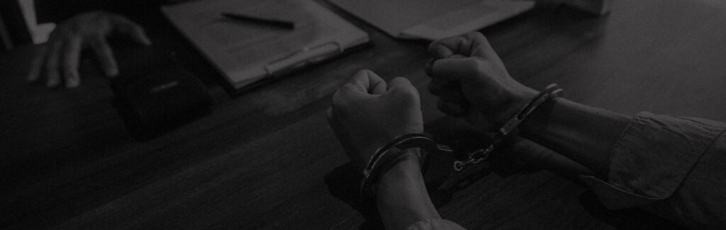 Person in handcuffs during interrogation